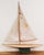 Charming small pond yacht Original paint and sails No stand There are some condition issues to both sails and hull. These...