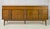 Striking Mid-Century Modern triple dresser credenza from the Zenith line by Bassett Furniture Industries. Crafted in warm,...