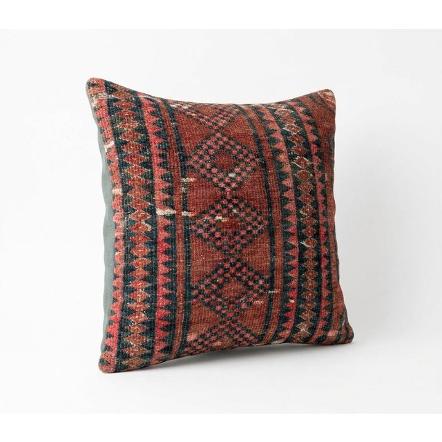 This beautiful 20'' x 20'' pillow cover was made from an authentic Turkish rug. Bright colors of wool adorn the front of...