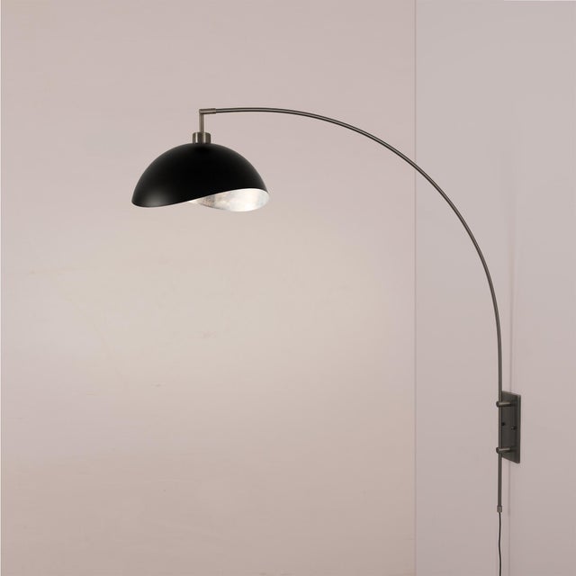 The Luna Bella Wall Arc Lamp is a sophisticated lighting solution featuring a sleek black nickel steel body and a striking...