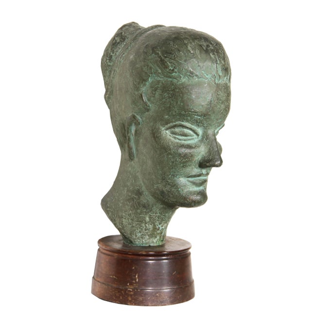 Woman with Bun Ruth Gutman Medium: Bronze Sculpture, initials inscribed Year: Not specified Size: 18.5 in. x 6.5 in. x 11...
