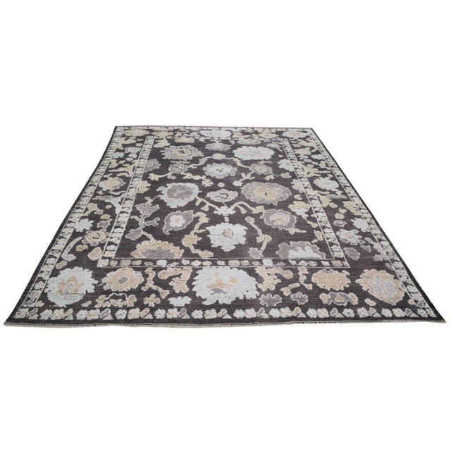 Turkish Oushak hand knotted rug with natural colors, contemporary style and soft hi-low texture.