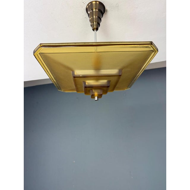 An exceptional French Art Deco pendant light marked by Degué, one of the most celebrated glassmakers of the Art Deco...