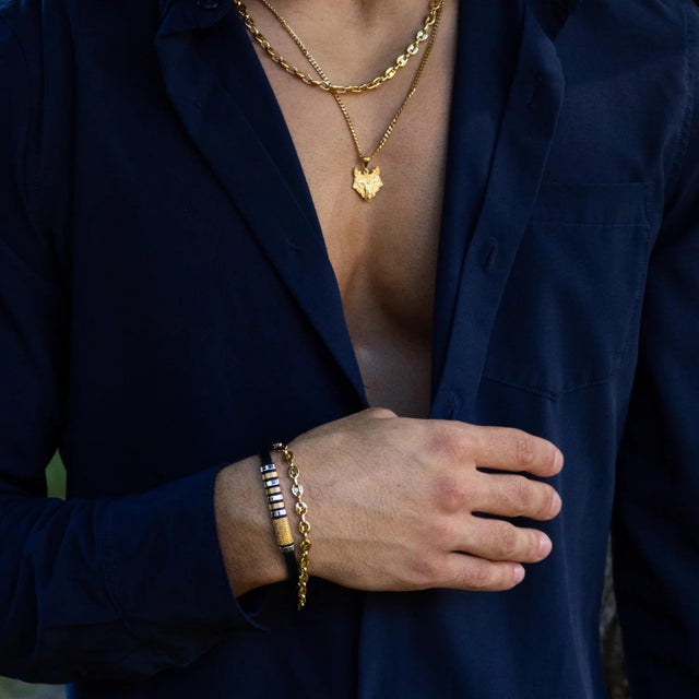 Add a touch of timeless elegance to your style with the Fleur-de-lis Dual Tone Leather Bracelet. Handcrafted with genuine...