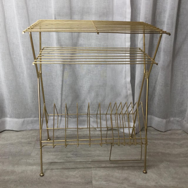 Iconic Mid Century Gold Wire Record Player Stand with Record Storage. I love the two accent starburst designs on the...