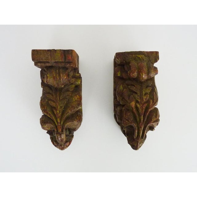 Pair of Indian carved wooden wall candlesticks. 19th century A superb pair of Indian wall candlesticks carved in wood and...