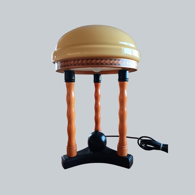 This vintage table lamp was produced by Temde Leuchten, a German–Swiss lighting manufacturer known for well-crafted...