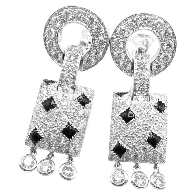 18k White Gold Panthere Diamond And Black Onyx Earrings by Cartier. **These earrings come with service paper from Cartier...