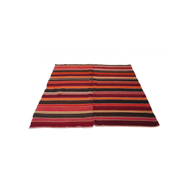 Handwoven vintage striped decorative kilim rug from Denizli region of Turkey. Approximately 50-60 years old. In very good...