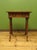 An attractive small work table dating to the early 20th Century. Made of mixed woods the table features a decorative...