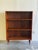 Mid-Century Modern Danish cabinet crafted in warm, richly grained teak. This versatile piece features an open shelving...