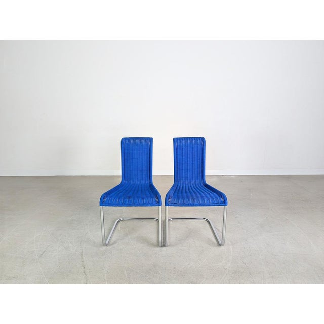 Beautiful set of two Tecta B20 cantilever chairs in a modern blue for sale. Designed by Jean Prouvé, these chairs are...