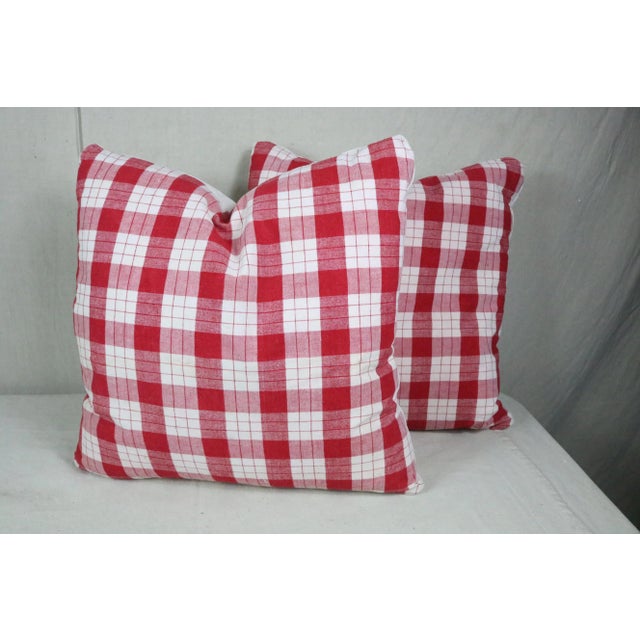 A pair of throw pillows made from 19th century French antiques materials. The red check top is made of linen homespun...