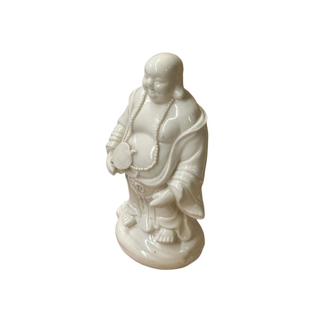 Embrace a touch of serenity and good fortune with this stunning white porcelain statue of the Happy Laughing Buddha. Known...