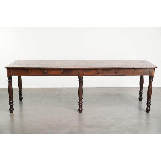 This unique English XXL farmhouse dining table is made of oak in beautiful, deep, warm tones and dates from the early 19th...
