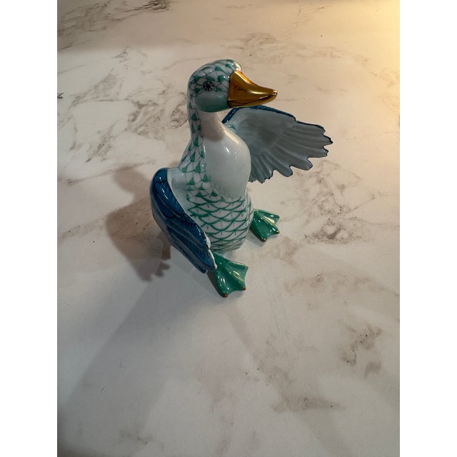 A charming Herend porcelain goose figurine from the celebrated fishnet (Vieux Herend) series, marked First Edition. The...