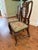 A stunning pair of Queen Anne side chairs that marry exceptional craftsmanship with extraordinary needlepoint artistry....