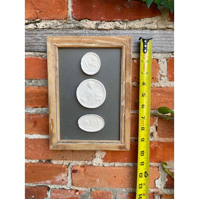 Immerse yourself in the enduring allure of classical antiquity with this truly unique collection of framed intaglios....