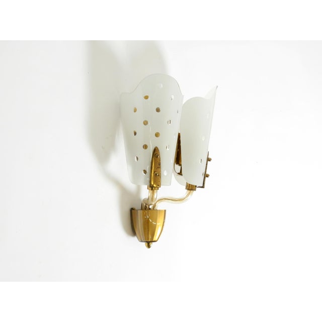 Large original Mid-Century Modern wall lamp made of perforated metal and glass. Beautiful, typical, high-quality 1950s...