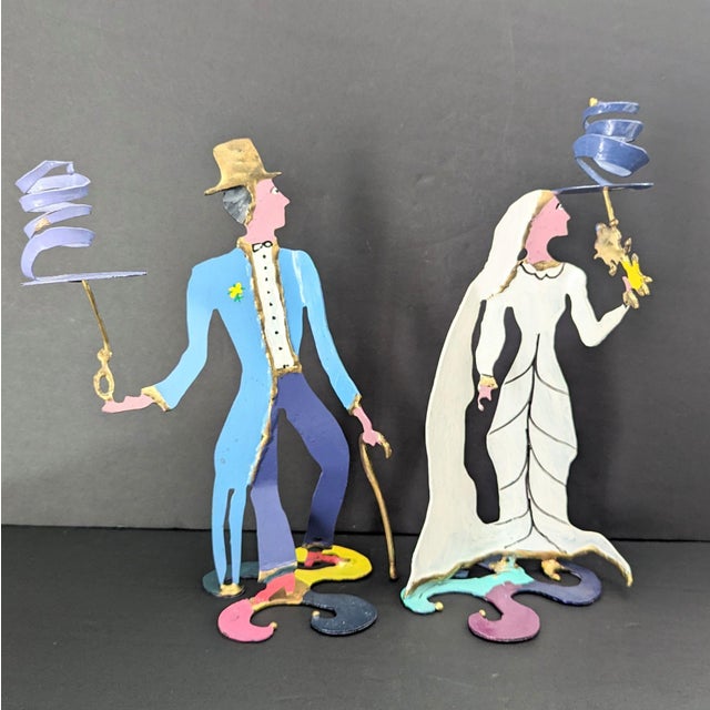 Add a touch of elegance to your home with these hand-painted metal sculptural candle holders. Perfect for any room, these...