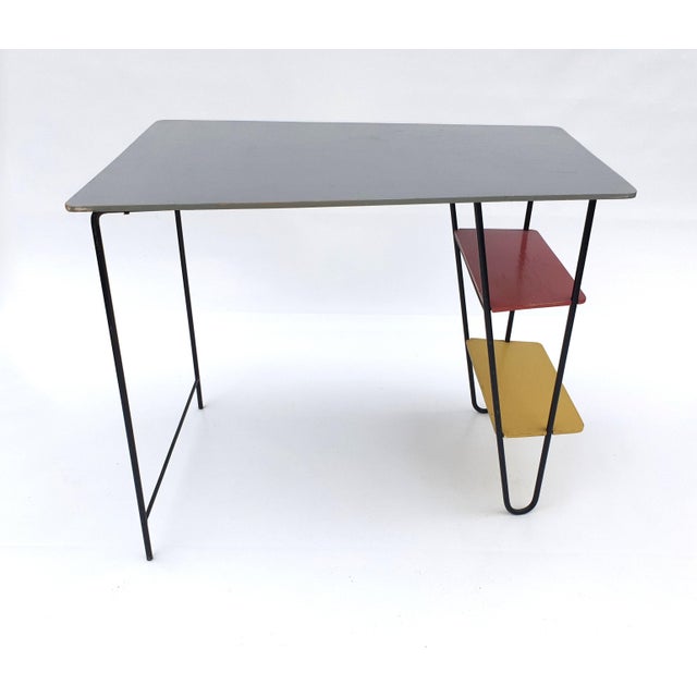 Extremely rare small desk designed and executed around 1955 by the son of Gerrit Th. Rietveld. The writing table is in an...