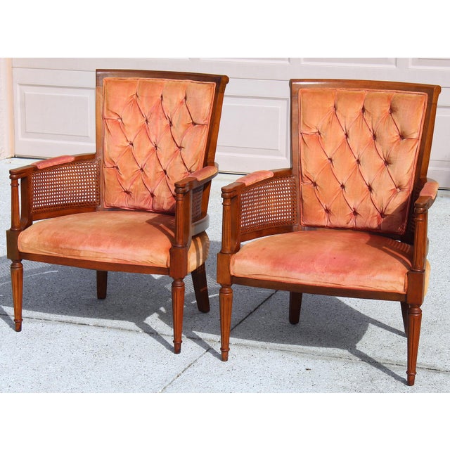 This elegant pair of vintage tufted velvet upholstered Mid-Century Modern armchairs features classic silhouettes, refined...