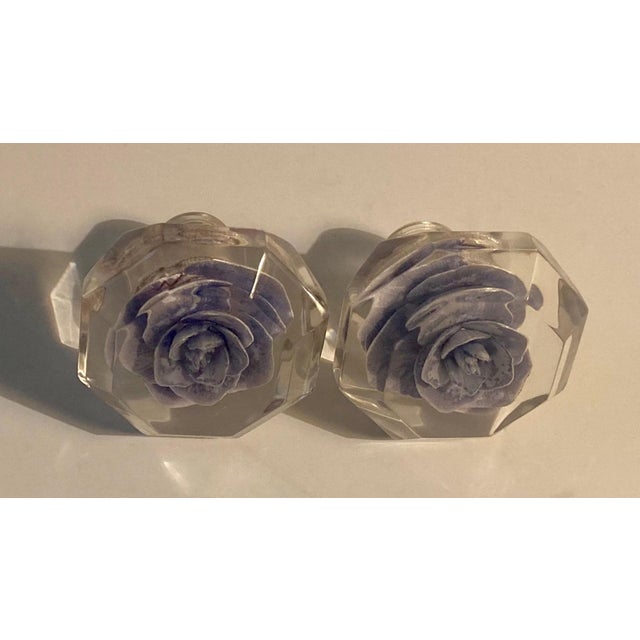 Reverse carved lavender rose incased in clear lucite with set screws. The pair would enhance an armoire when used as door...