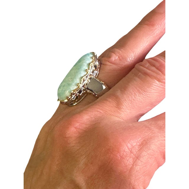 This stunning ring features an oversized Larimar gemstone in a teardrop shape. The ring is sterling silver with gold...