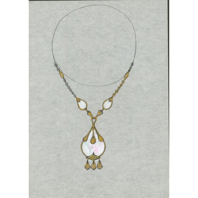 Original jewelry design for an elegant necklace with elongated white teardrop elements, gold-tone fittings and a large...