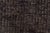 This is a vintage Turkish Oushak rug from the Mid 20th Century. The piece was hand-knotted.