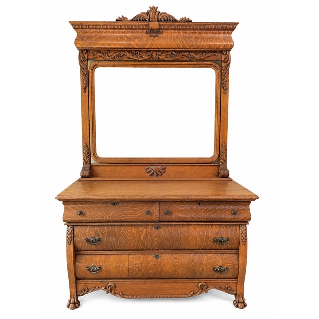 Exceptional American antique dresser crafted in richly figured quarter-sawn oak, displaying the dramatic tiger-stripe and...