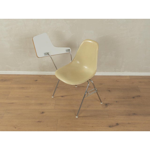 DSS-TA chair by Charles & Ray Eames for Herman Miller from the 1960s. Stainless steel frame with fiberglass seat shell and...