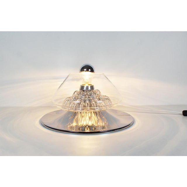 Illuminate your space with this absolutely stunning vintage Italian table lamp from the 1970s! This exquisite piece...