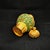 This highly decorative piece features a magnificent gold-tone body lavishly decorated with vibrant emerald green enamel....