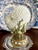 A striking vintage porcelain nautilus shell sculptural vase mounted atop a naturalistic coral-form base with gilt accents...