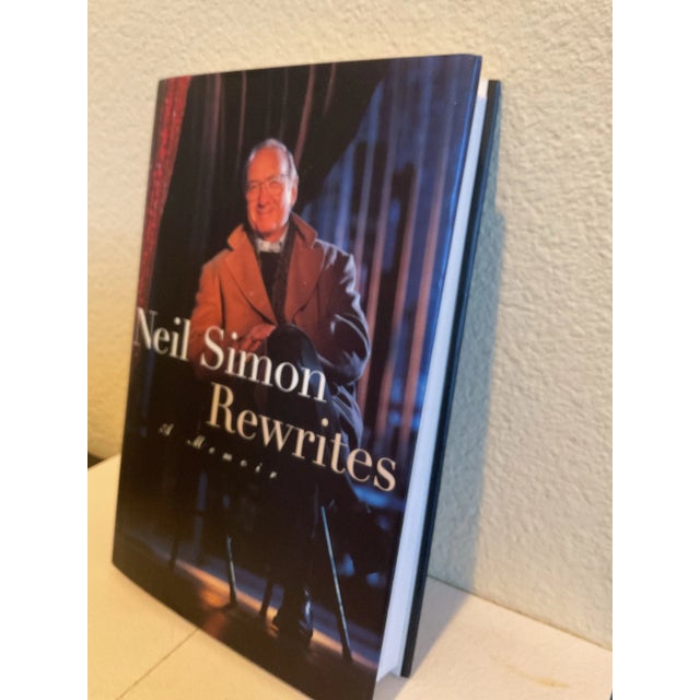 Neil Simon's book is a concise story of his life and very interesting. It is signed "October 1996" which is the book and...