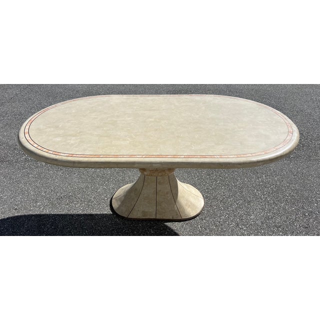 Introducing the exquisite Tessellated Stone & Brass Dining Table by Maitland Smith, Philippines 1980's. This remarkable...