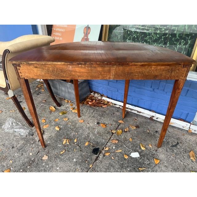 This antique console table is a stunning addition to any room. Crafted from beautiful yew wood, it exudes charm and...