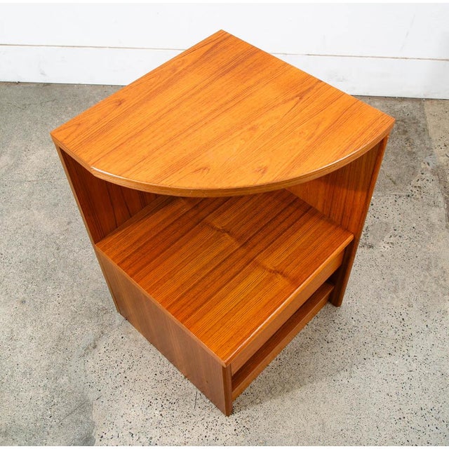 Single teak nightstand with storage shelves and single drawer. Marked "Made in Denmark" on the back. Well made piece.