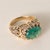 Victorian Revival Colombian Emerald & Diamond Ring – Circa 1960s A striking expression of vintage elegance, this ornate...