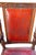 Heavily and ornately hand carved all over. Originally with a cane seat, replaced long ago with padded red leather. Sits...