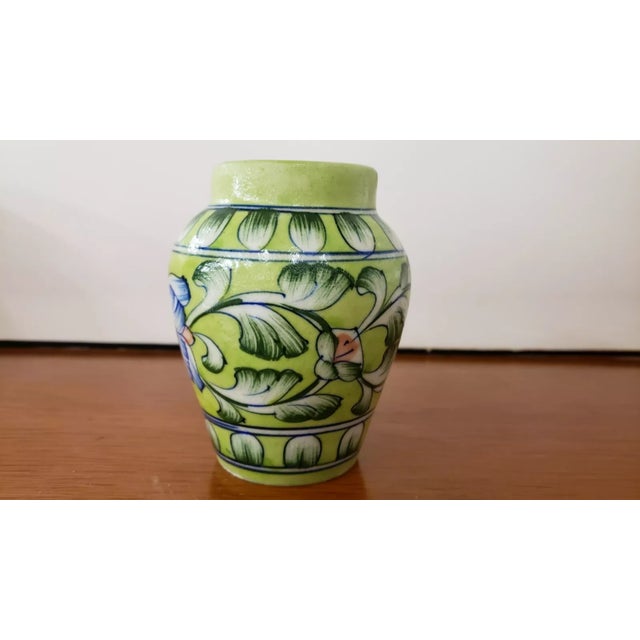 This is a Circa 1900 Italian Majolica Porcelain Banded Floral Motif Vase. It measures 4 1/4" tall and 3 5/8" wide. The...