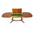 Classic Danish teak dining table featuring a sculptural trestle base and a clever draw-leaf extension system. Unlike the...
