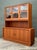 Exemplifying the pinnacle of Danish Modern design, this monumental teak sideboard and hutch by the renowned maker Dyrlund...