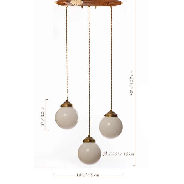 This light fixture is made from authentic vintage lamp parts. The base is antique wooden weaving shuttle with brass parts....