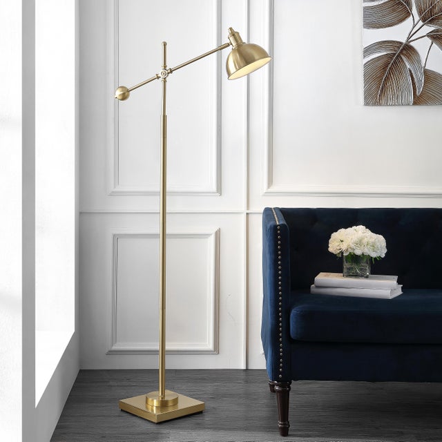 Illuminate your space with the stylish Dagen floor lamp, crafted from brass and iron. Its graceful extendable design...