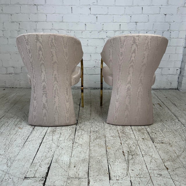 Vintage Hollywood Regency upholstered Carson’s armchair in great modern form, featuring a brass cantilever frame with a...