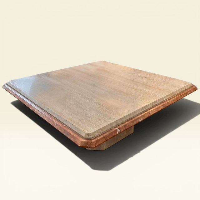 Italian coffee table in Travertine marble with Coralito marble trim. Symmetrical and balanced, original from the 1960s and...