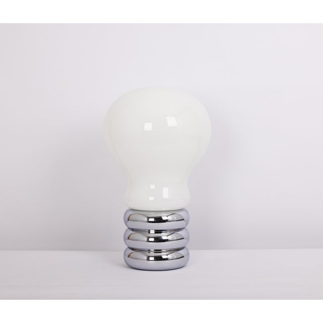 An iconic “bulb” table lamp designed by the renowned lighting designer ingo maurer in the 1960s for design m, germany....