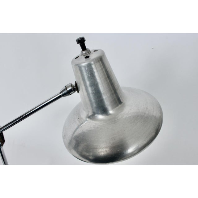 Adjustable Aluminum Shade desk lamp with Black enameled Base & Arm. Featuring an Aluminum Shade with ball socket,...
